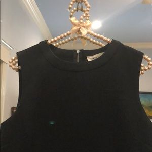 Black blouse with feather bottom trim